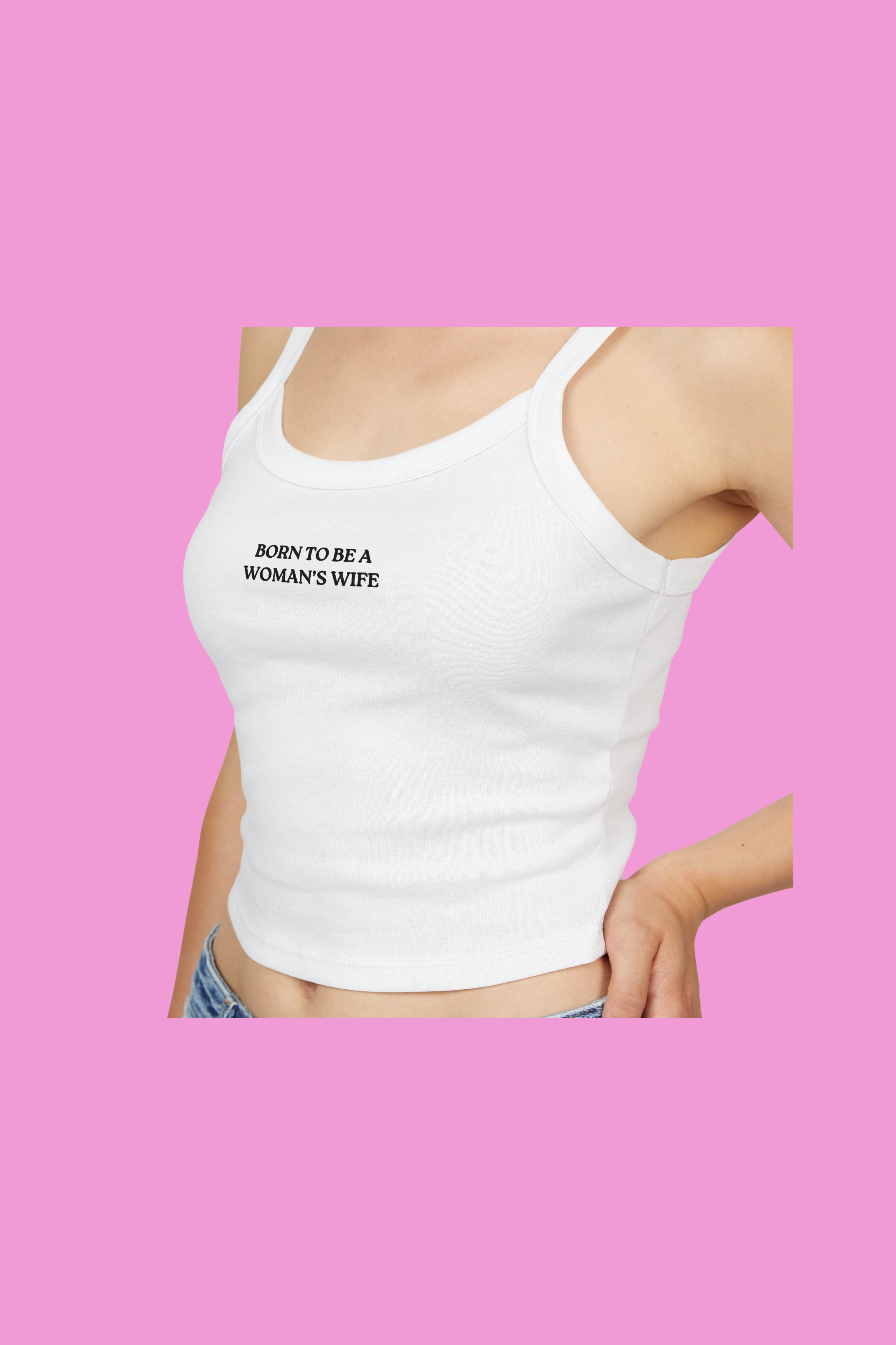 White tank top with 'BORN TO BE A WOMAN'S WIFE' text on a pink background